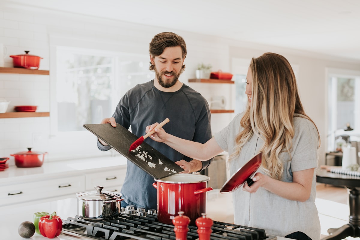 Adult child talking with elderly parent at home